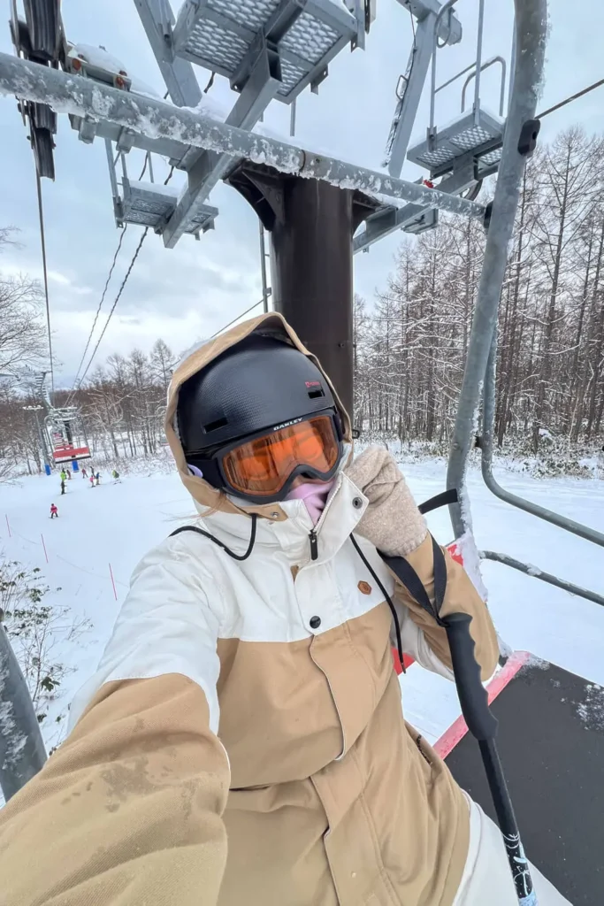 What to wear when skiing in Hokkaido, Japan: ski helmet, snow goggles, and ski jacket